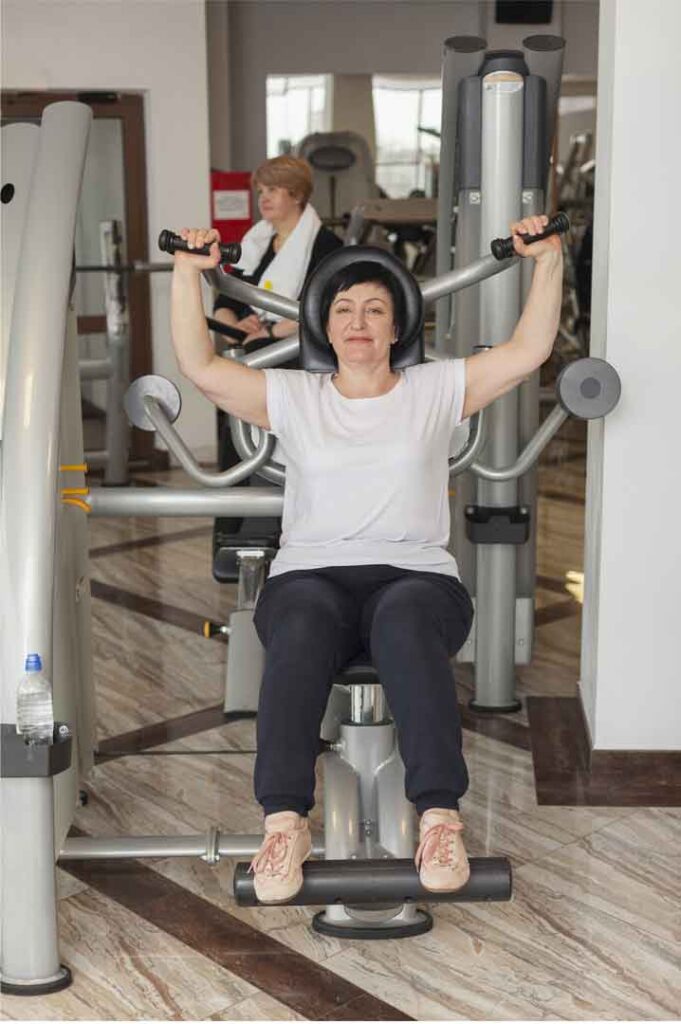old-woman-Exercise-in-gym-using-butter fully-Machine
